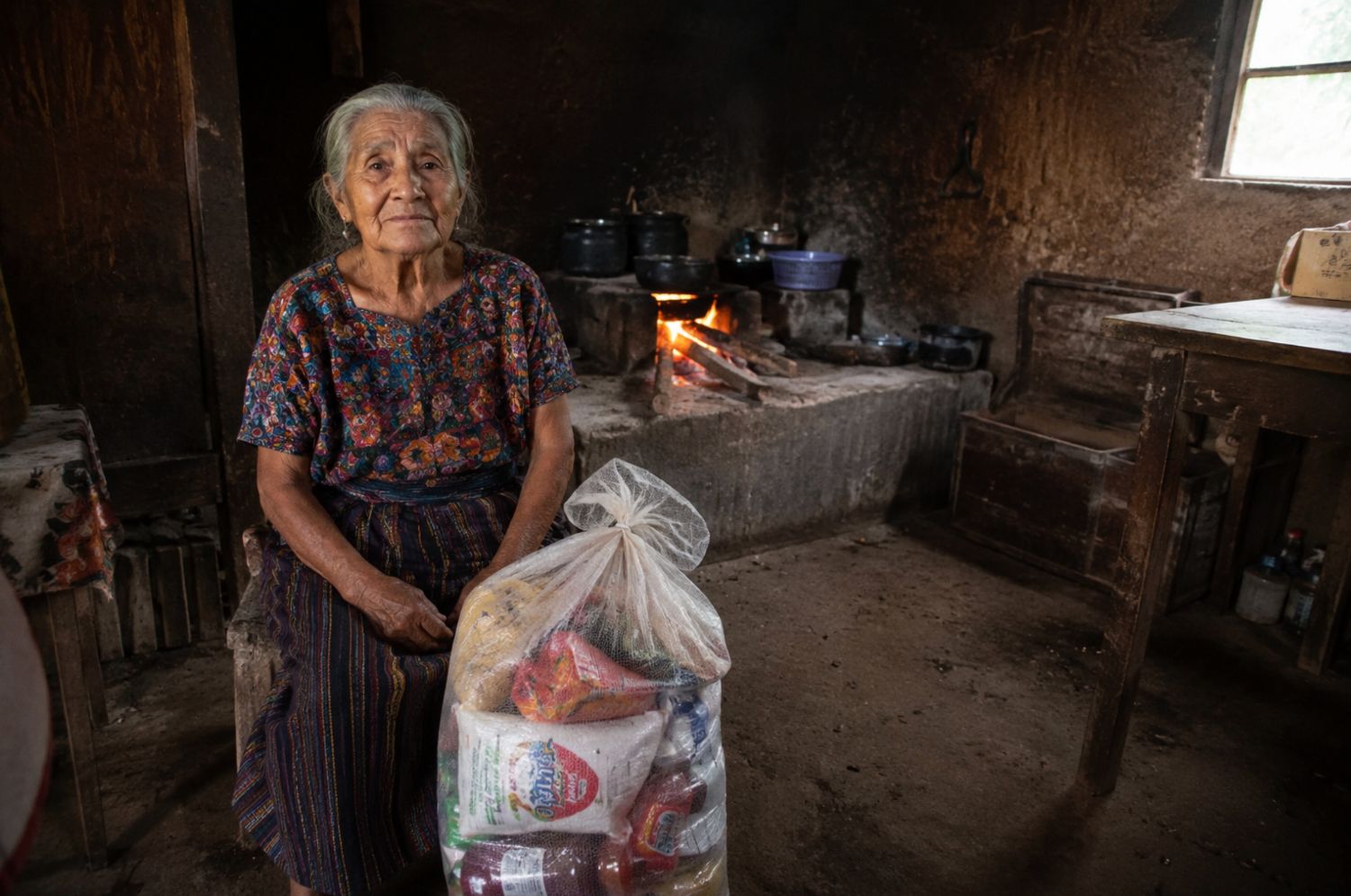 An elder receiving food support at home